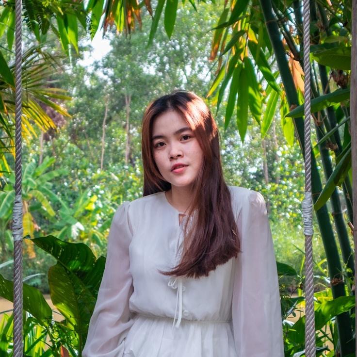 Nova Malik, Lead Design Curator at Pioneer Orchard Path, reviewing corporate floral arrangements